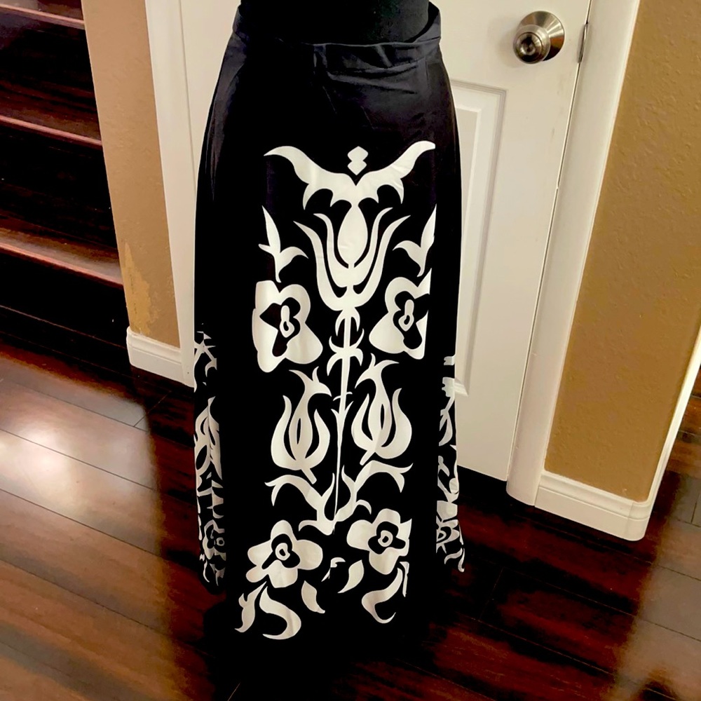 A woman’s nylon size medium black and white maxi skirt it’s 39 inches long